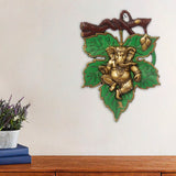 eCraftIndia Dancing Golden Lord Ganesha on Green Leaf Metal Wall Hanging